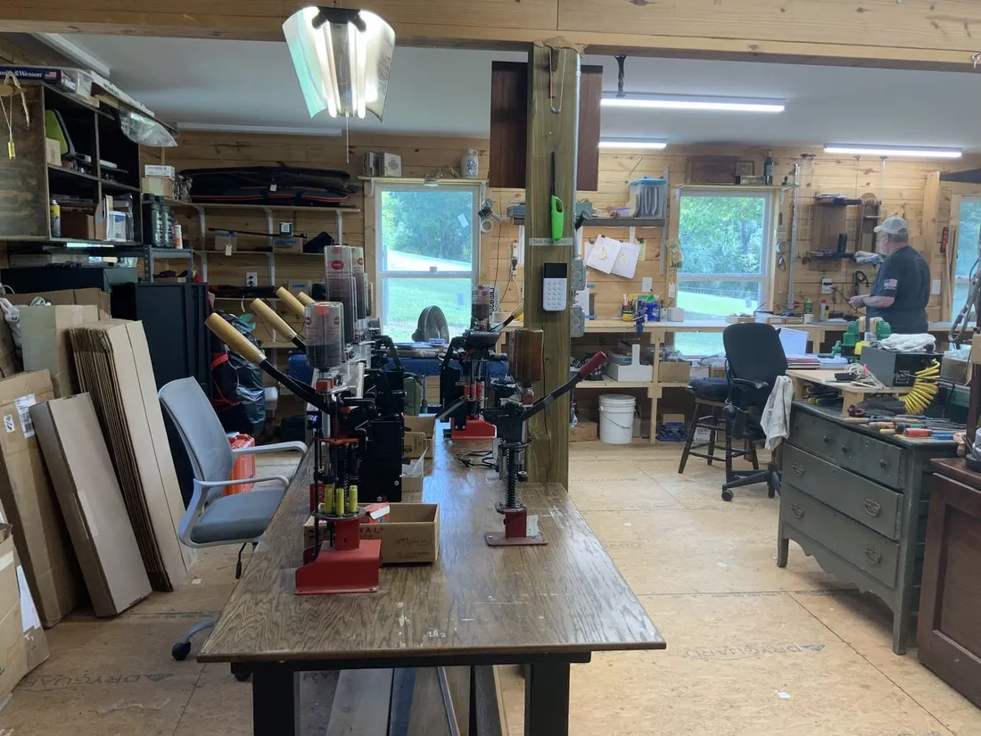 Walnut blanks stacked on end beside the duplicating bench